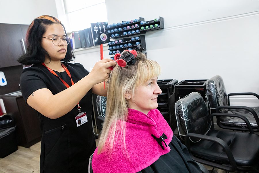 Hairdressing student working on a client